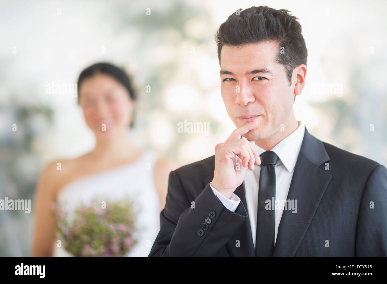 Groom smiling in wedding ceremony Stock Photo