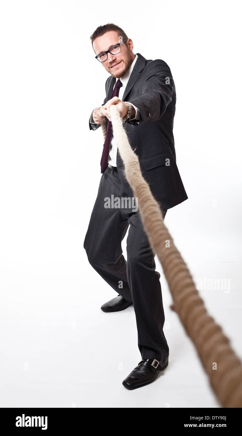 caucasian businessman pull the rope Stock Photo