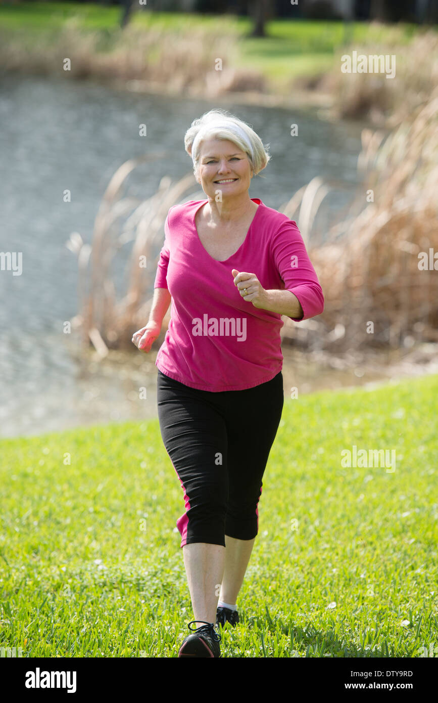 Power walking mature woman hi-res stock photography and images - Alamy