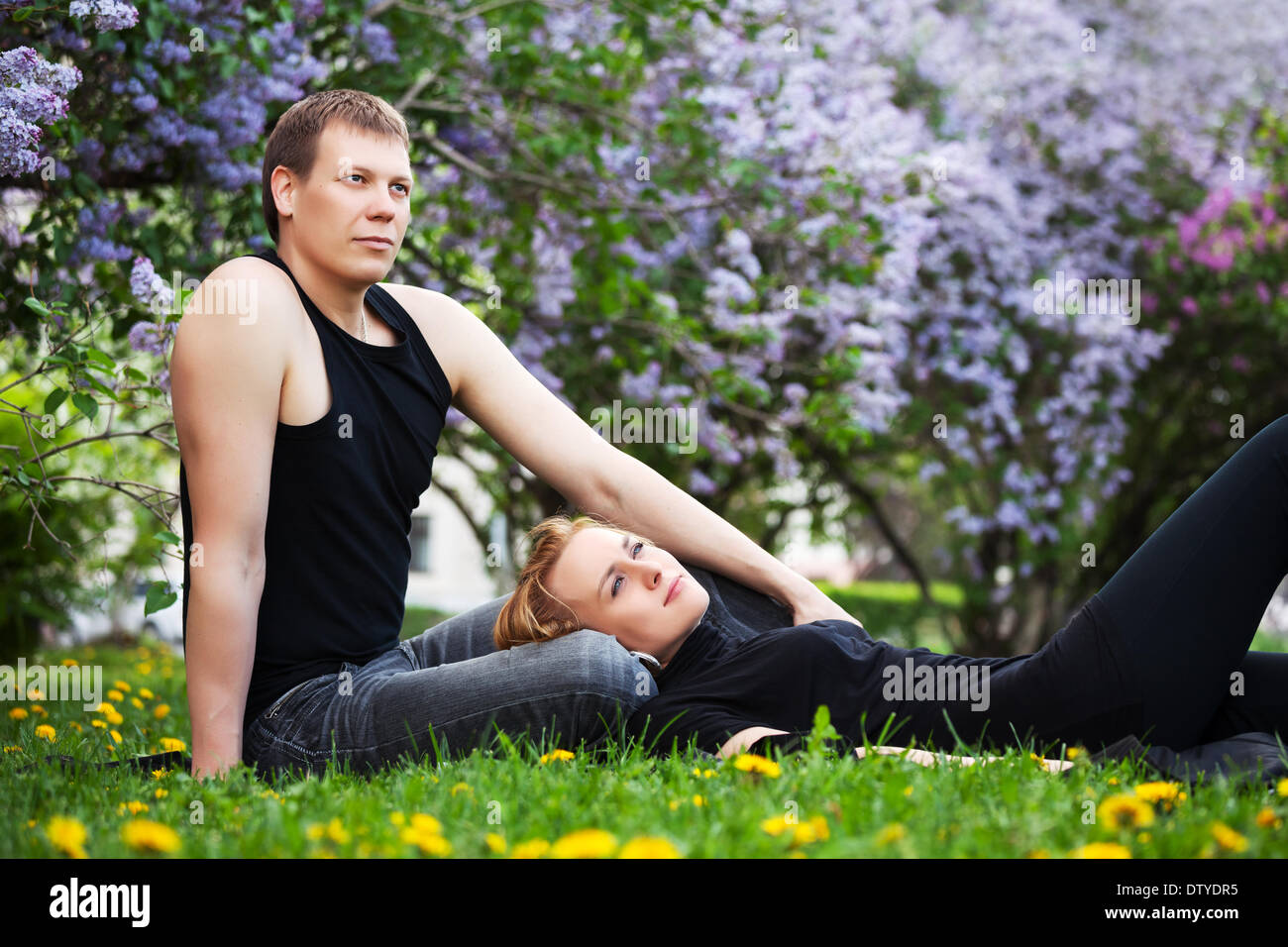 Happy young couple in a city park Stock Photo - Alamy