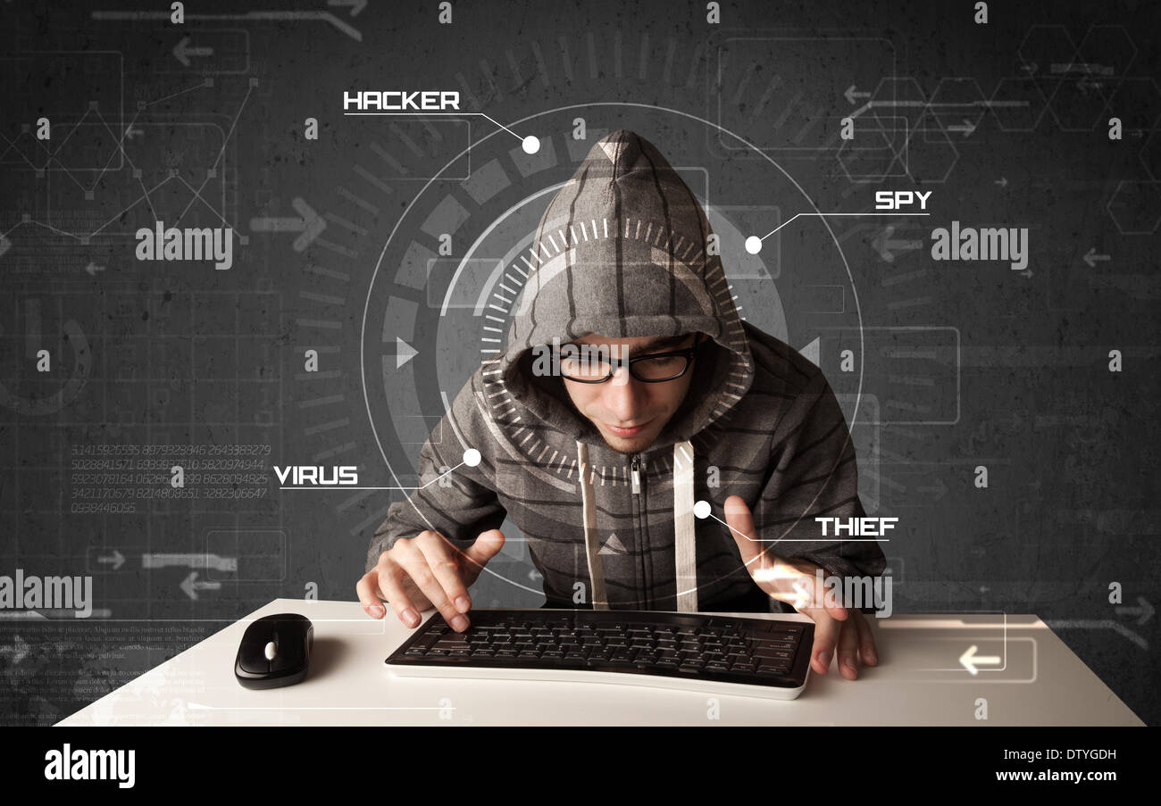Young hacker in futuristic enviroment hacking personal information Stock Photo