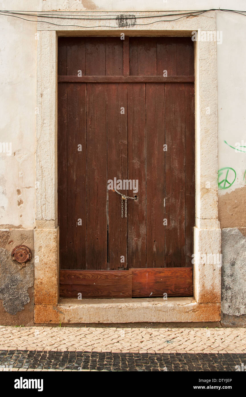 old doorway chained shut in Lagos Portugal Stock Photo