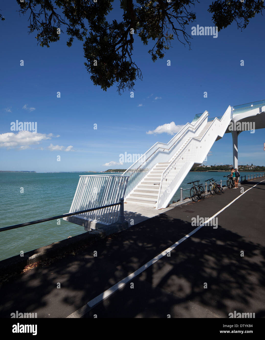 Point Resolution Bridge, Auckland, New Zealand. Architect: Warren and Mahoney , 2013. Oblique view of bridge on waterfront. Stock Photo