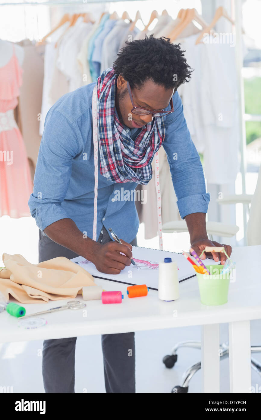 Attractive fashion designer drawing Stock Photo - Alamy