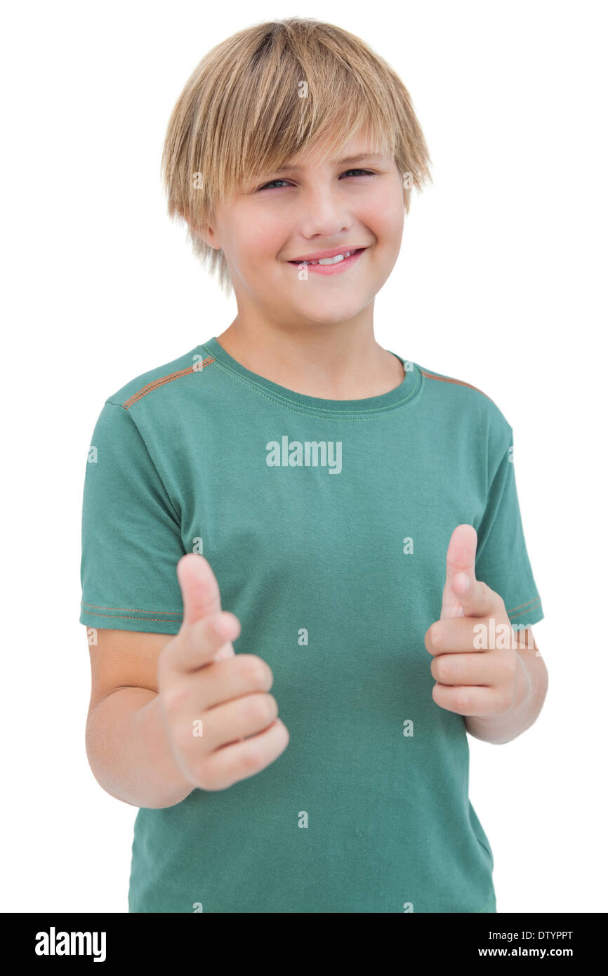 Smiling young boy with a green shirt Stock Photo - Alamy
