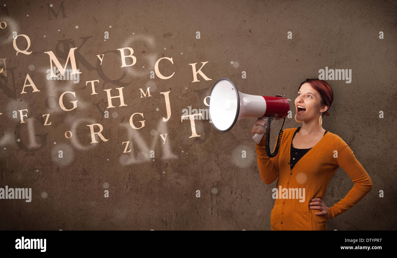 Young girl shouting into megaphone and text come out Stock Photo Alamy