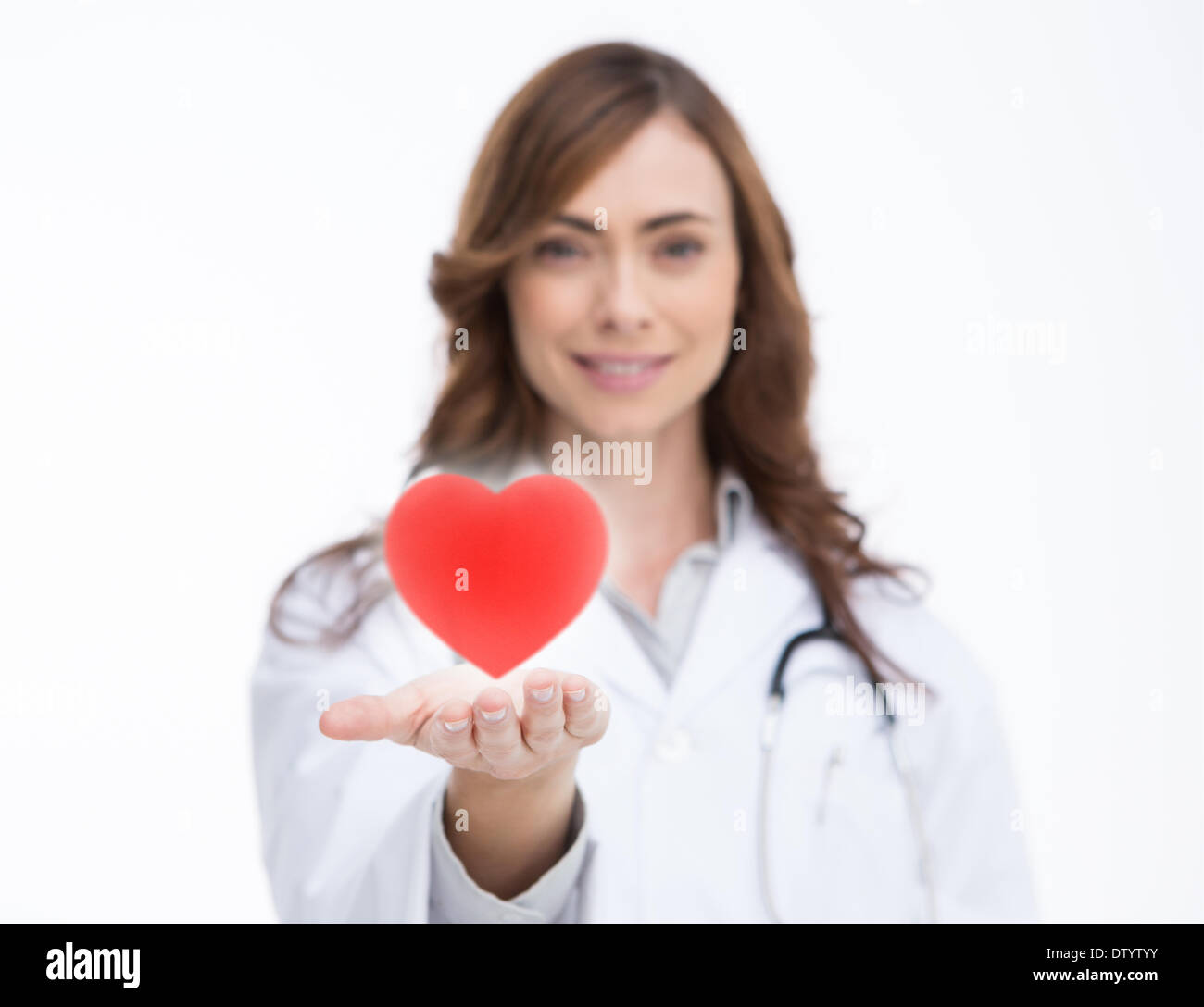 Doctor holding a red heart Stock Photo - Alamy