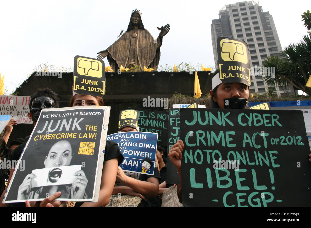 Manila, Philippine, . 25th Feb, 2014. Participants of the Black Tuesday demonstration carry posters against the Cybercrime Act of 2012 in Edsa Shrine in Quezon City. -- Different media groups, together with student activists, commemorated the 28th anniversary of the Edsa Revolution with a protest rally against the Cybercrime Law. Credit:  J Gerard Seguia/NurPhoto/ZUMAPRESS.com/Alamy Live News Stock Photo
