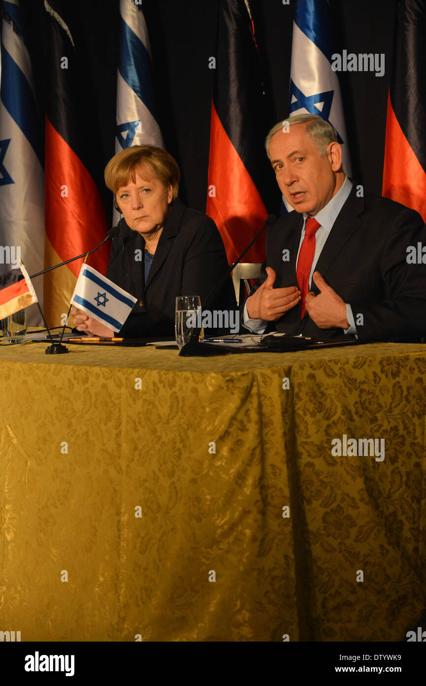 Jerusalem, Israel. 25th Feb, 2014. Israeli Prime Minister Benjamin Netanyahu (R) and visiting German Chancellor Angela Merkel attend a news conference at the King David Hotel in Jerusalem, on Feb. 25, 2014. Merkel is on a 24-hour visit to Israel, leading 16 ministers from her cabinet. Credit:  Li Rui/Xinhua/Alamy Live News Stock Photo