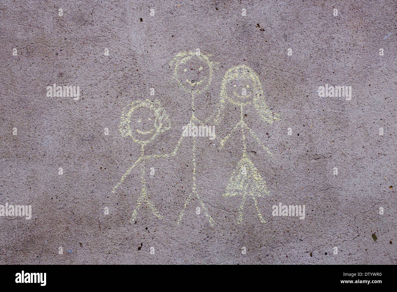Child's drawing, chalk on concrete, mother, father, child Stock Photo