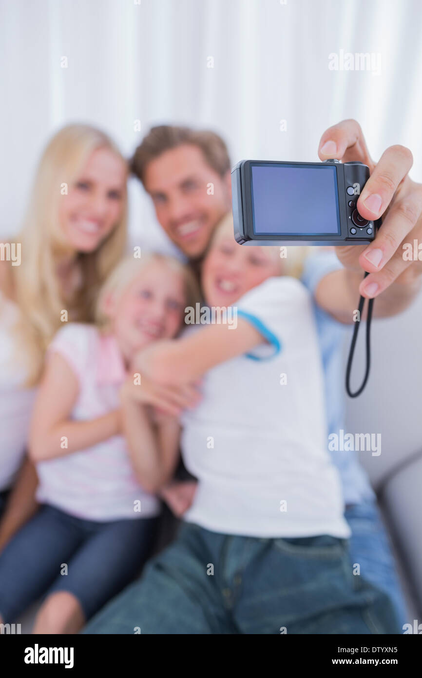 Father taking picture of his family Stock Photo