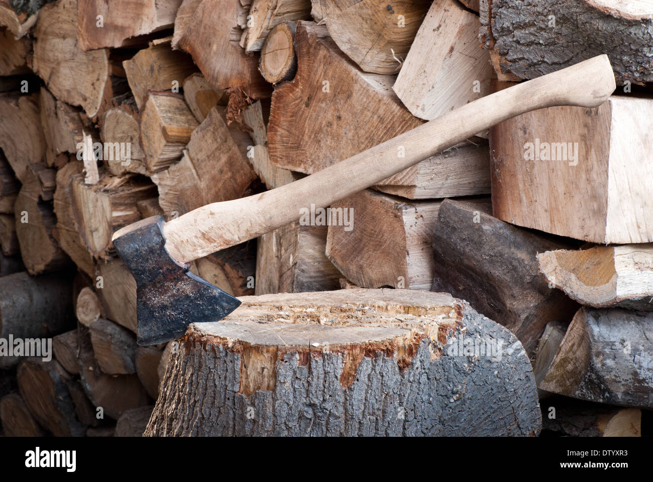 a big old ax with fire wood Stock Photo