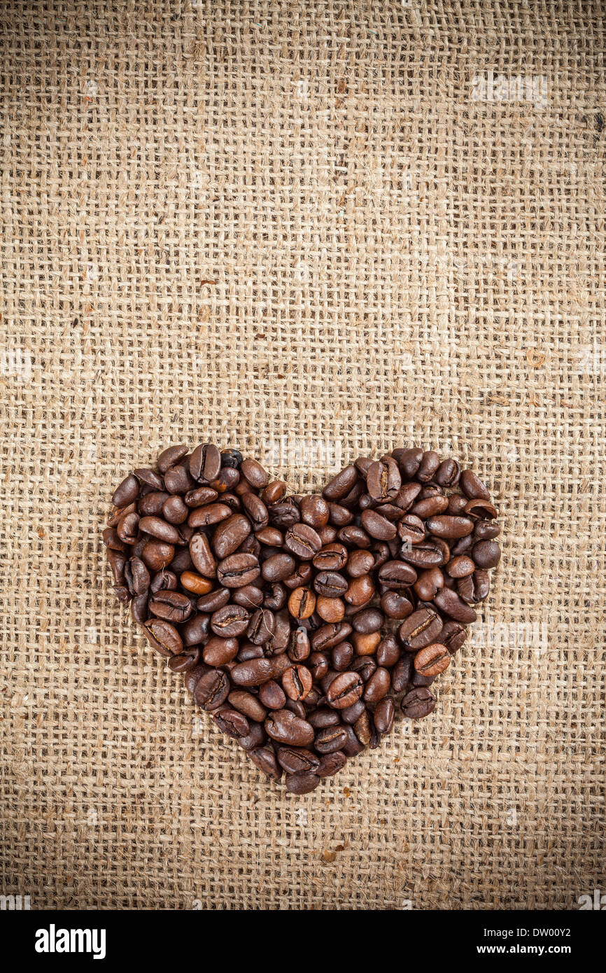 Heart shape made with coffee, canvas. Stock Photo