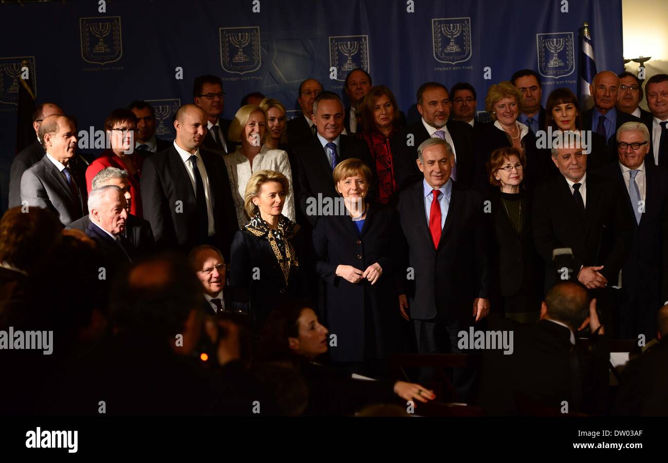 Jerusalem, Jerusalem, Palestinian Territory. 25th Feb, 2014. German Chancellor Angela Merkel (C-L), Israeli Prime Minister Benjamin Netanyahu (C-R) and the members of their cabinets pose for a family picture after their meeting at the King David hotel in Jerusalem on February 25, 2014. Merkel arrived in Israel with her cabinet yesterday to discuss nuclear talks with Iran and to encourage Prime Minister Netanyahu to reach a two-state solution with the Palestinians Credit:  Saeed Qaq/APA Images/ZUMAPRESS.com/Alamy Live News Stock Photo