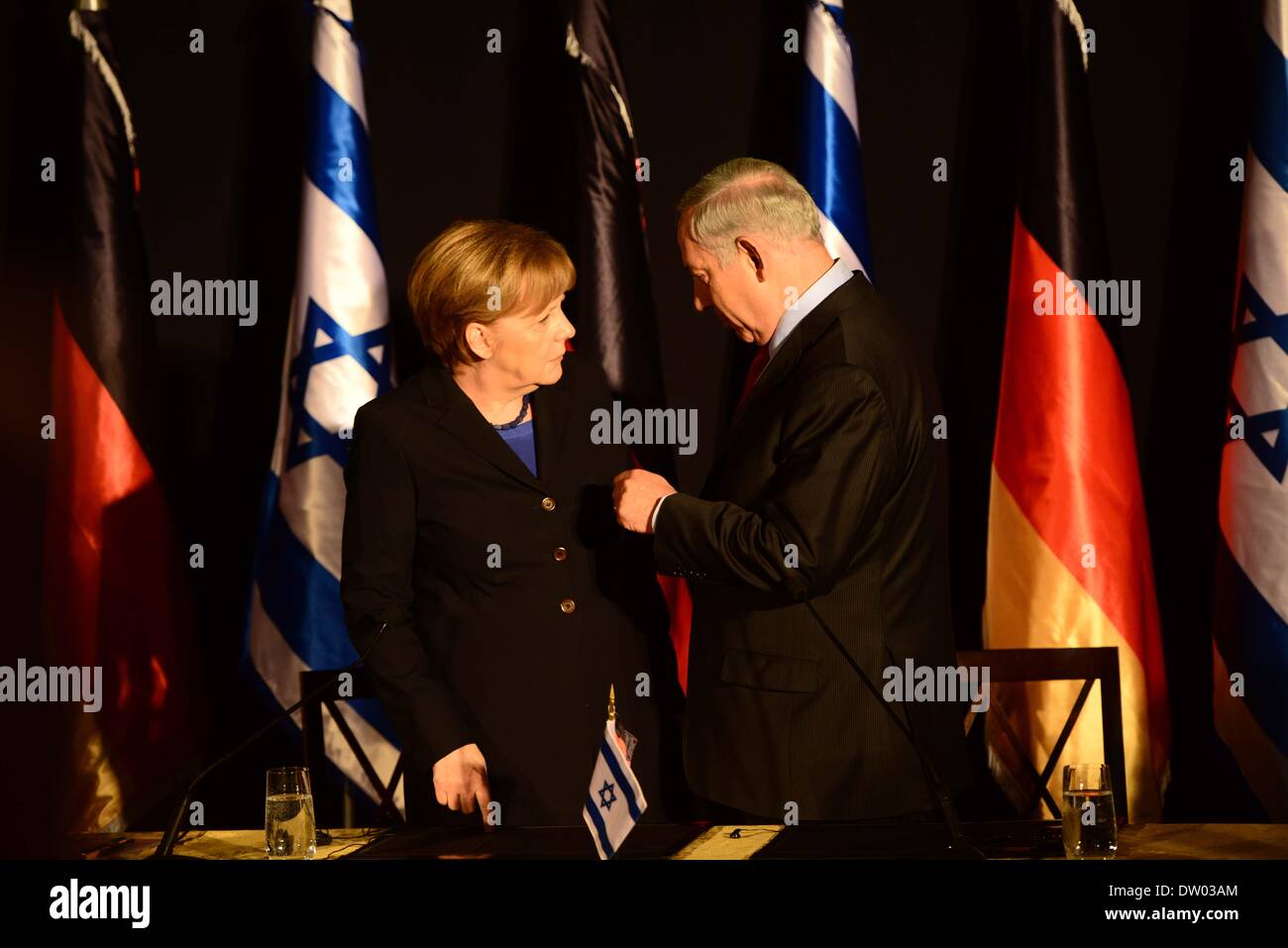 Jerusalem, Jerusalem, Palestinian Territory. 25th Feb, 2014. German Chancellor Angela Merkel (L) and Israeli Prime Minister Benjamin Netanyahu leave after attending a joint press conference at the end of their cabinets' meeting at the King David hotel in Jerusalem on February 25, 2014. Merkel arrived in Israel with her cabinet yesterday to discuss nuclear talks with Iran and to encourage Prime Minister Netanyahu to reach a two-state solution with the Palestinians Credit:  Saeed Qaq/APA Images/ZUMAPRESS.com/Alamy Live News Stock Photo