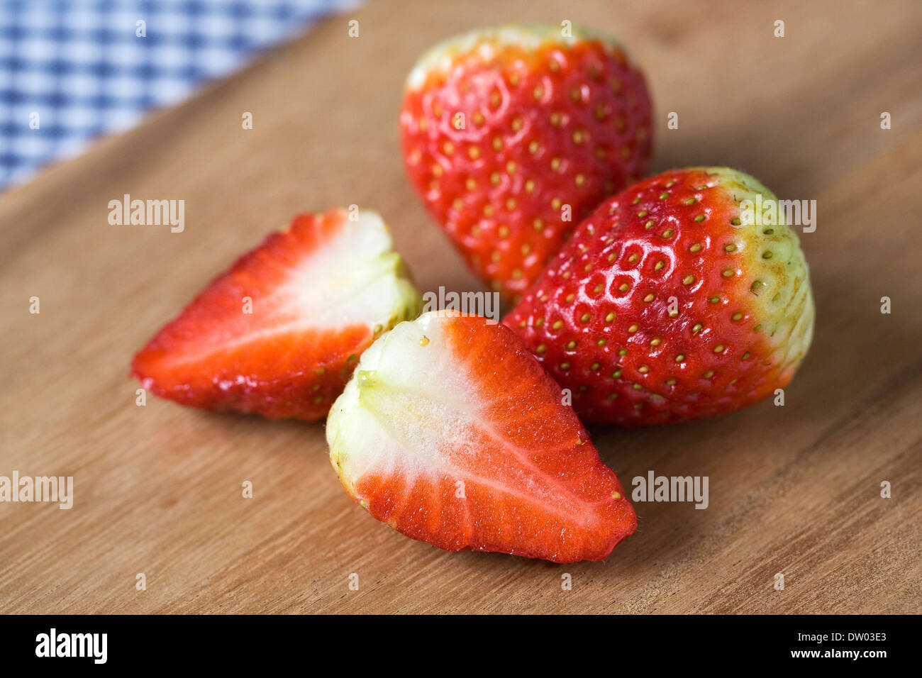 Fragaria. Strawberries on a wooden board. Stock Photo