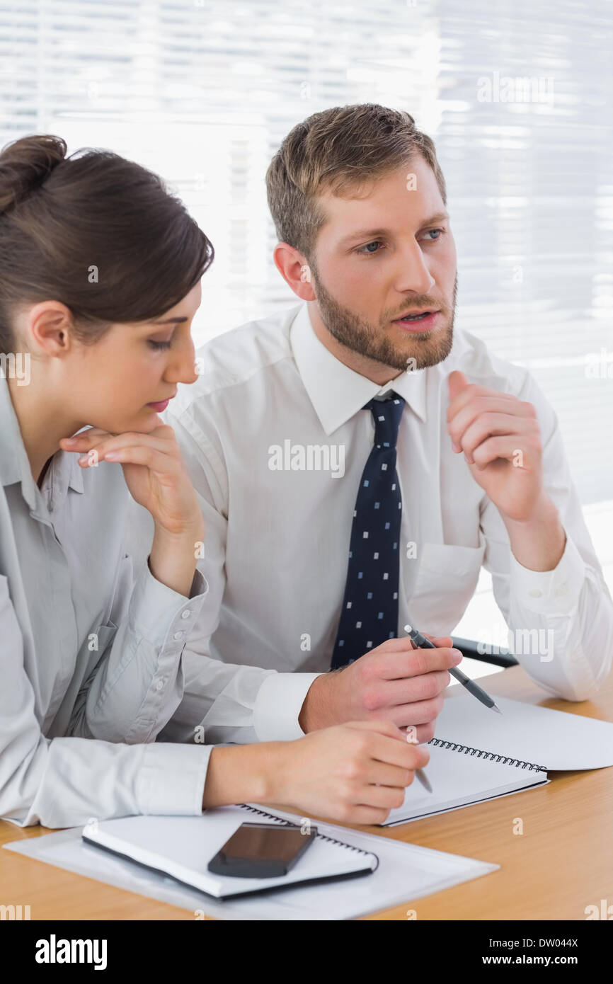 Business people discussing documents Stock Photo