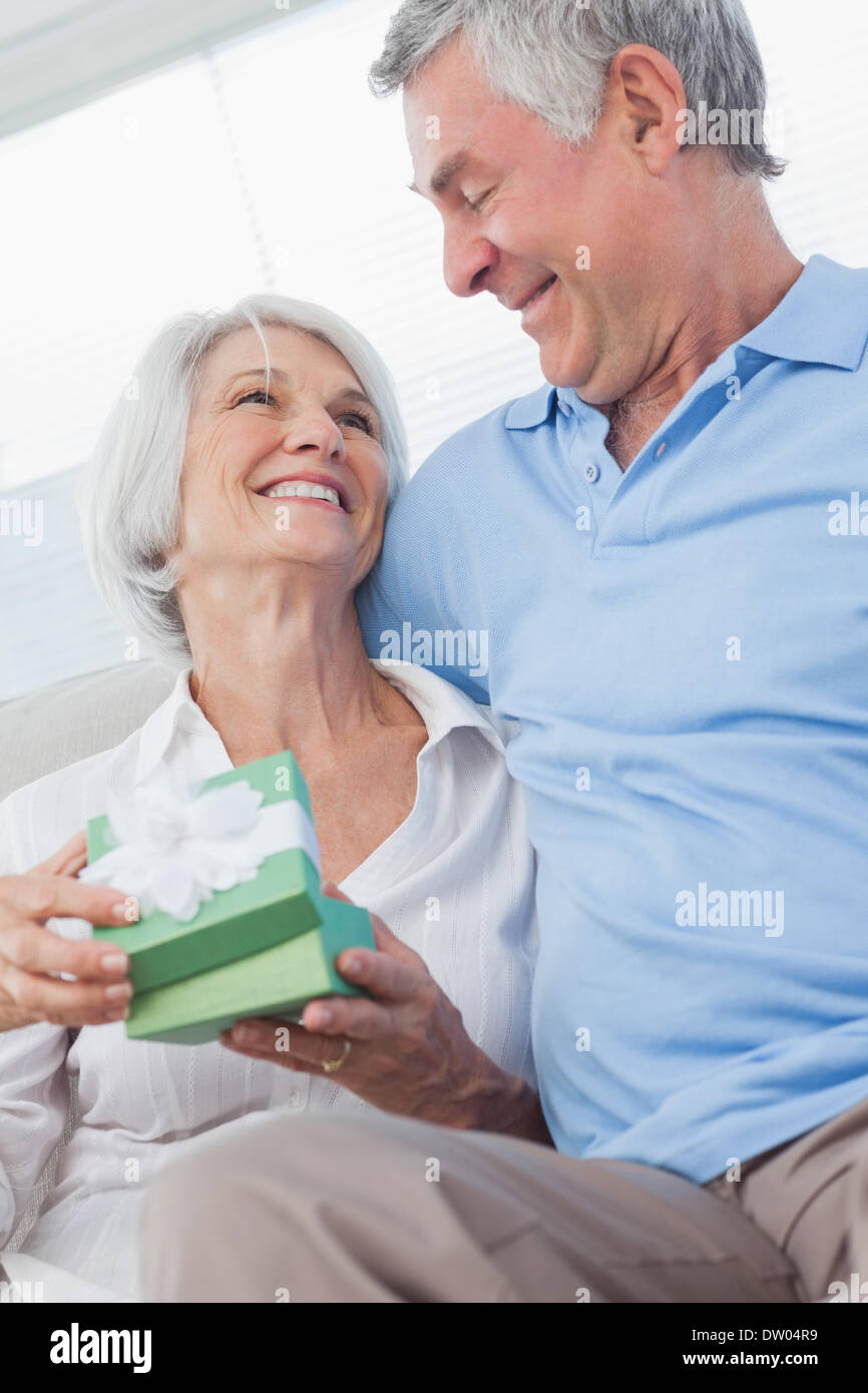 Husband giving a gift to wife Stock Photo Alamy