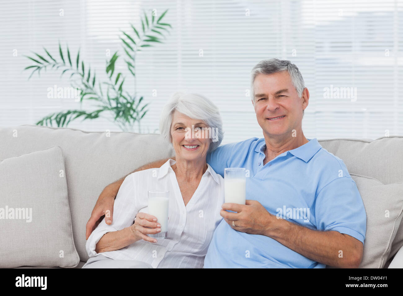 Couple drinking glasses of milk Stock Photo Alamy