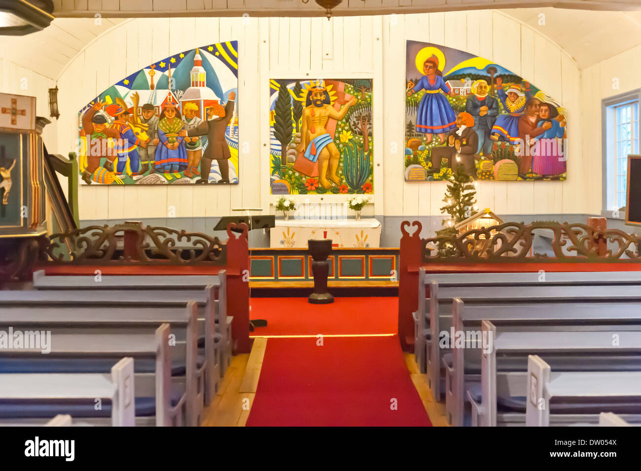 Sami art, colourful wood carvings, Sami-Christian altar area designed by artist Bror Hjort in the wooden church of Jukkasjärvi Stock Photo