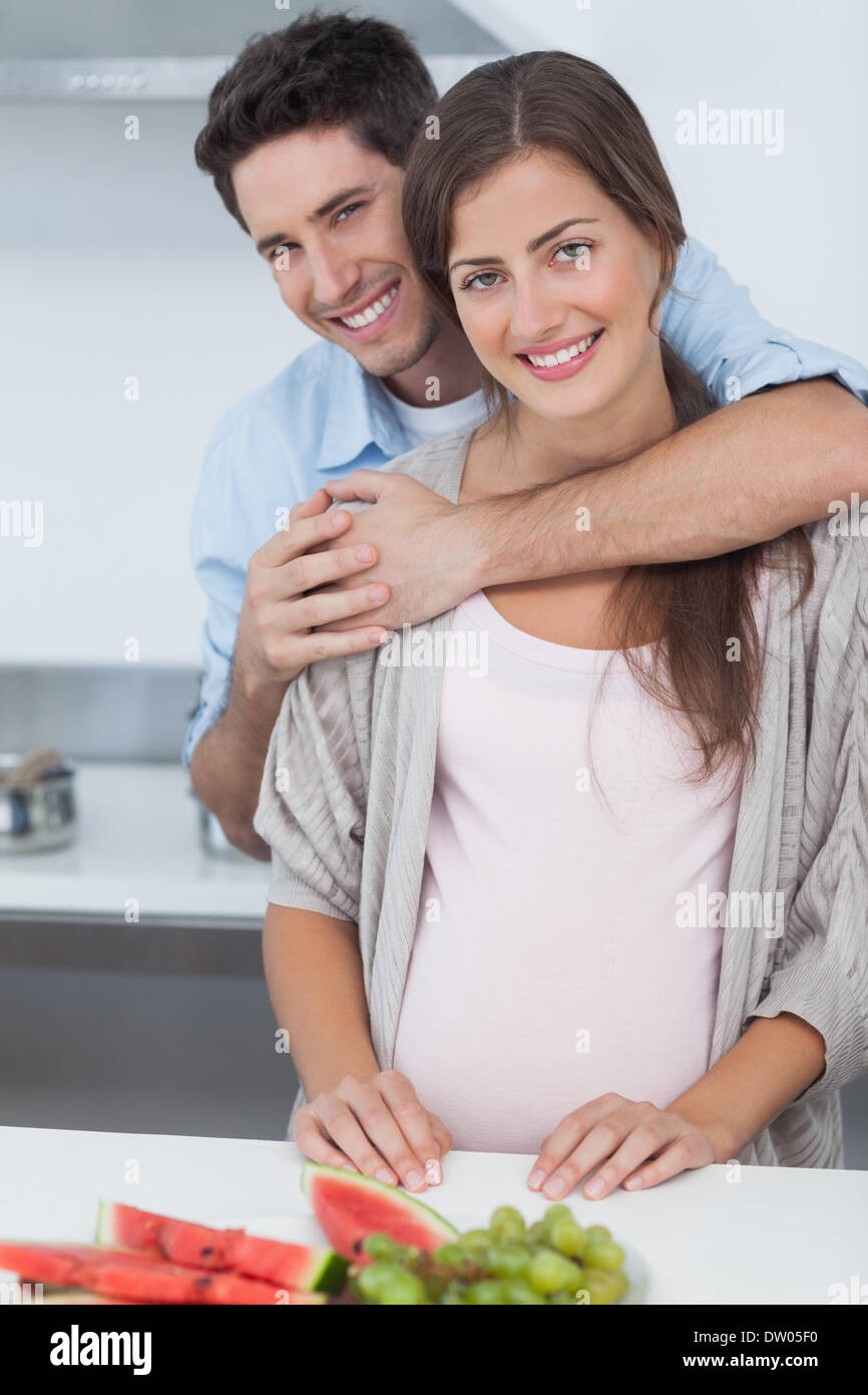 Man embracing his pregnant wife Stock Photo - Alamy