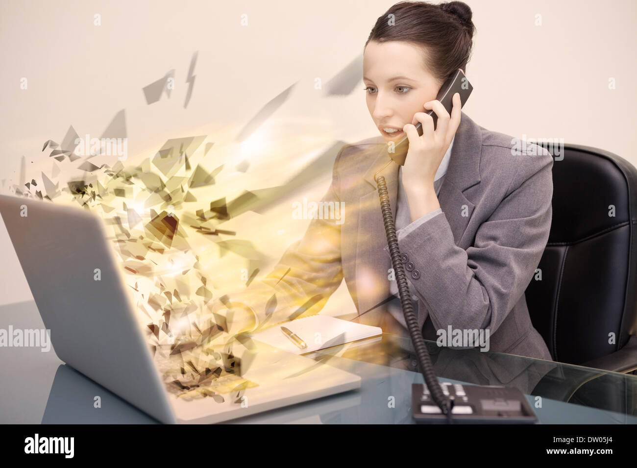 Laptop screen of a businesswoman exploding Stock Photo