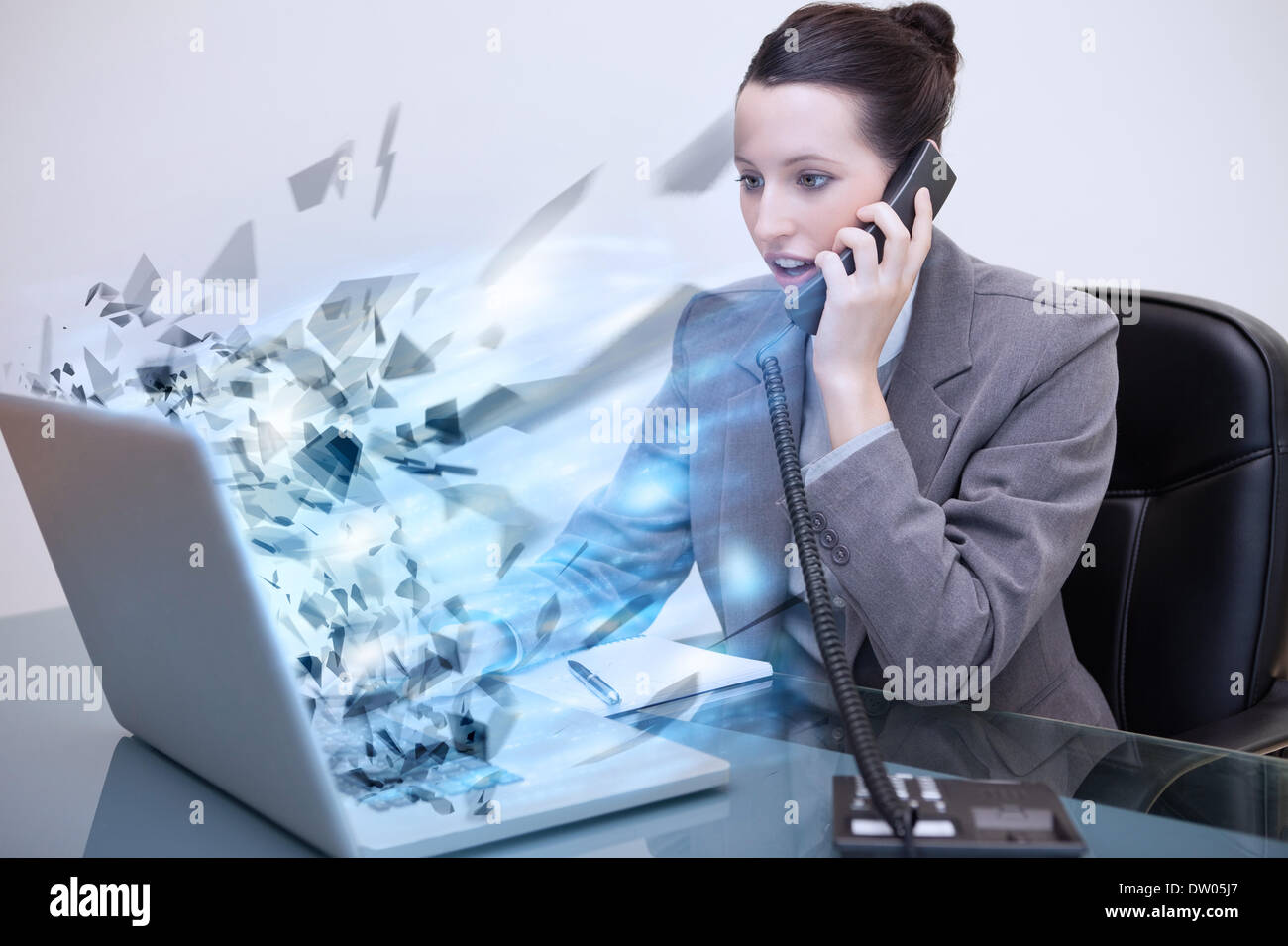 Laptop of a businesswoman exploding Stock Photo