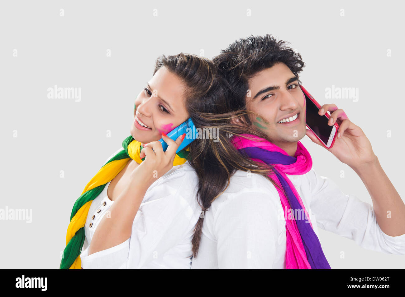 indian holi Festival Couple talking phone Stock Photo