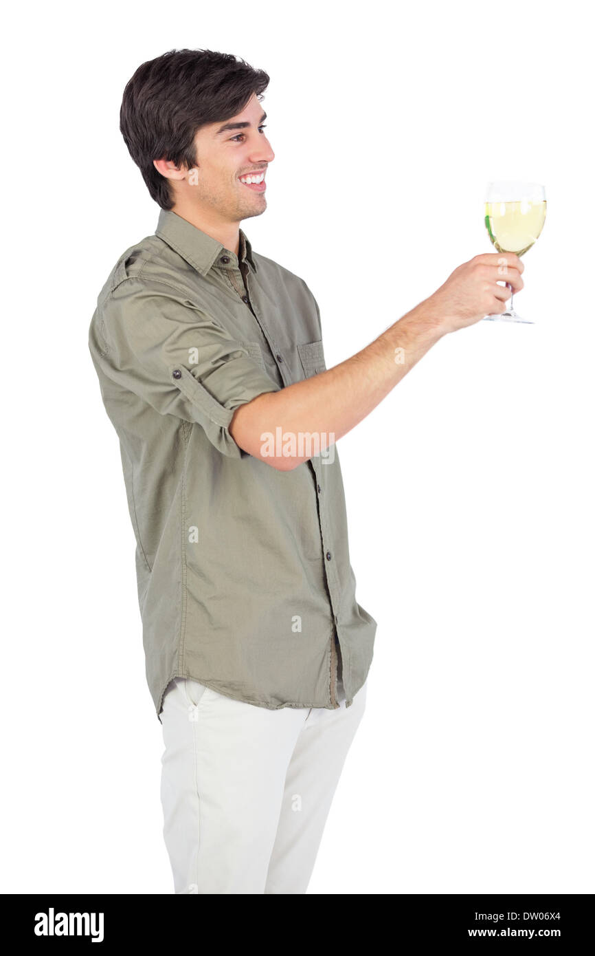 Happy young man with wine glass Stock Photo - Alamy