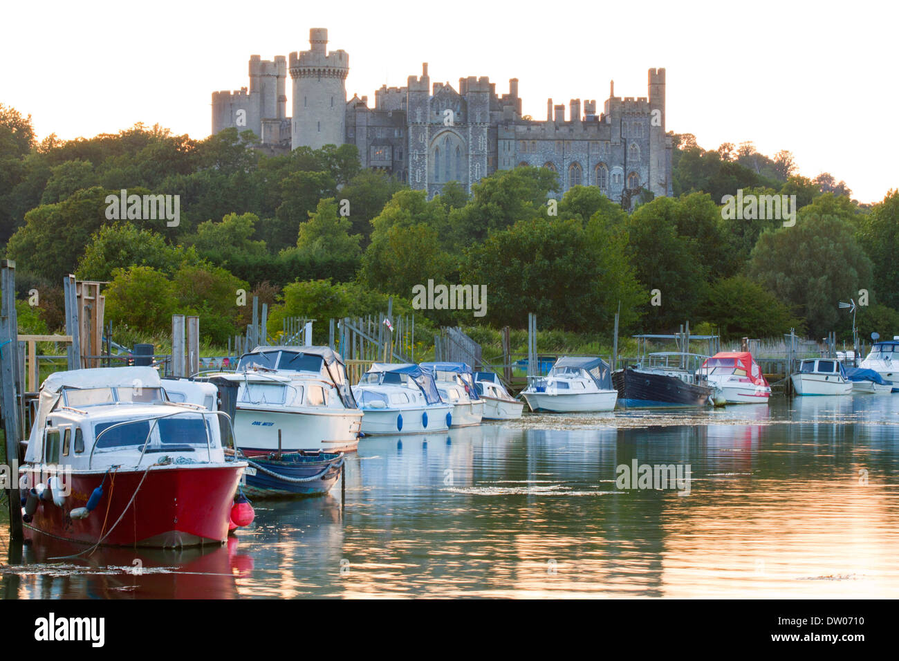 Arundel Castle and boats on the River Adur, dusk Stock Photo