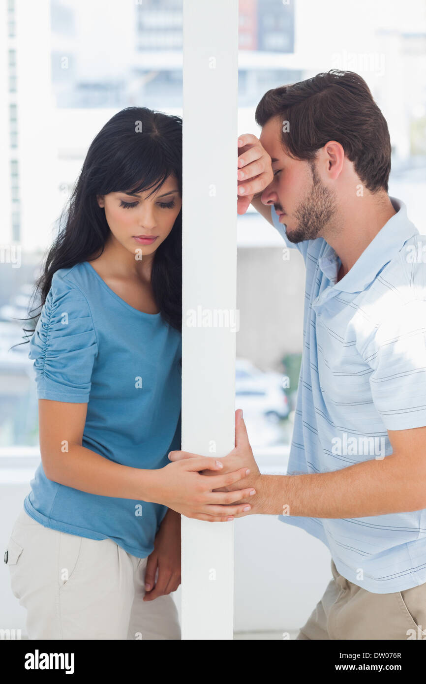 Couple are separated by white wall Stock Photo Alamy