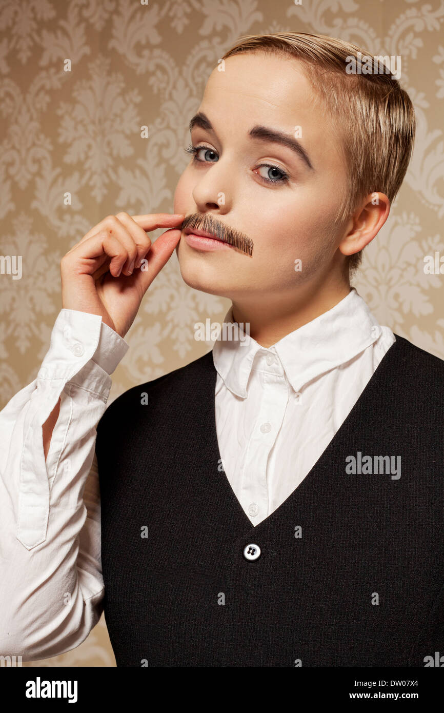 Woman pretending to be a man with moustache Stock Photo