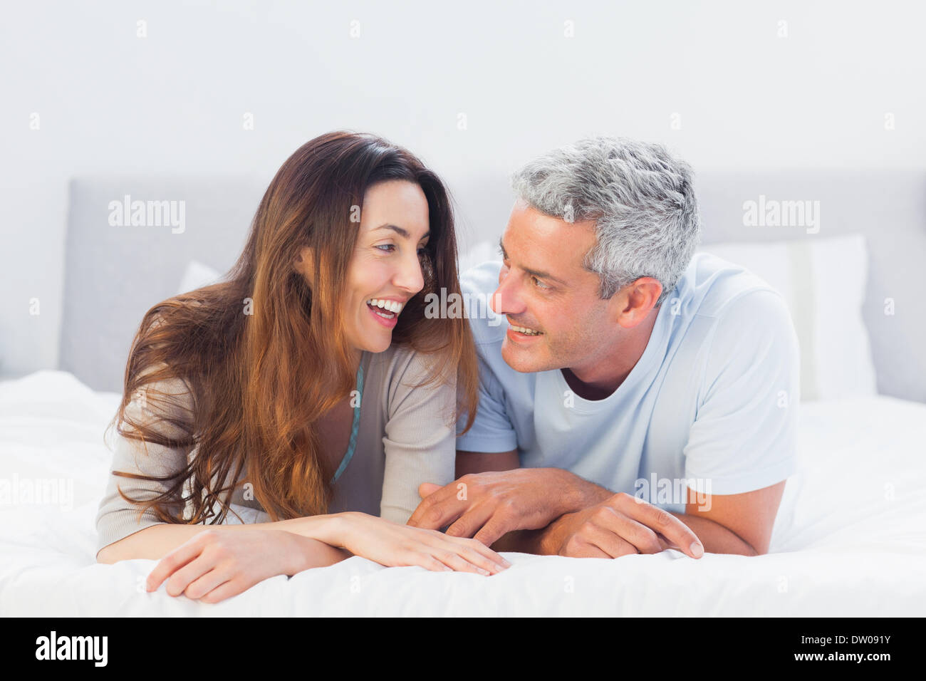 Couple lying talking together hi-res stock photography and images - Alamy
