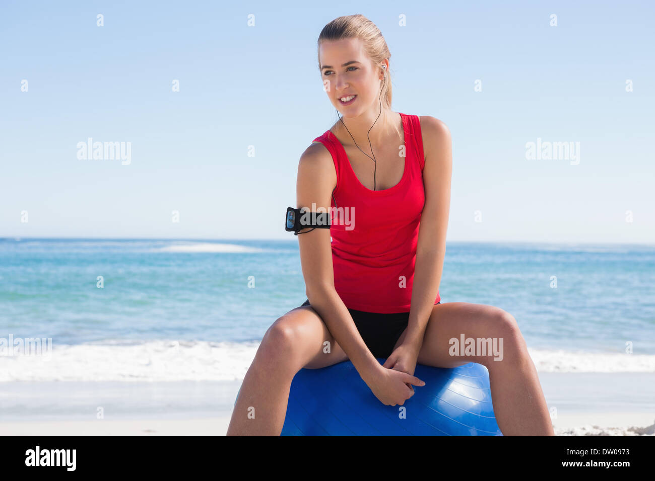 Fit woman sitting on exercise ball Stock Photo - Alamy