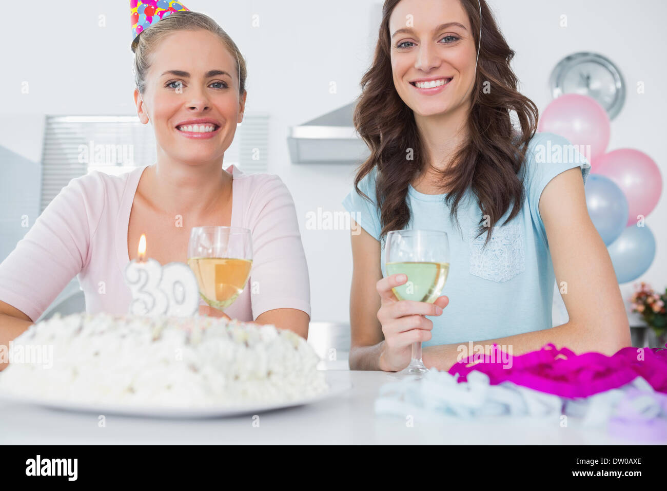 Cheerful women with birthday cake Stock Photo Alamy