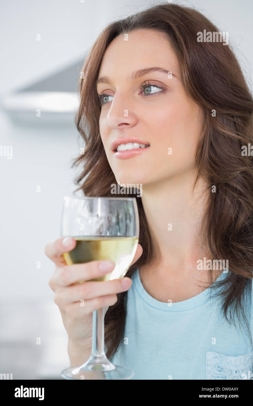 Thoughtful drinking white wine Stock Photo Alamy