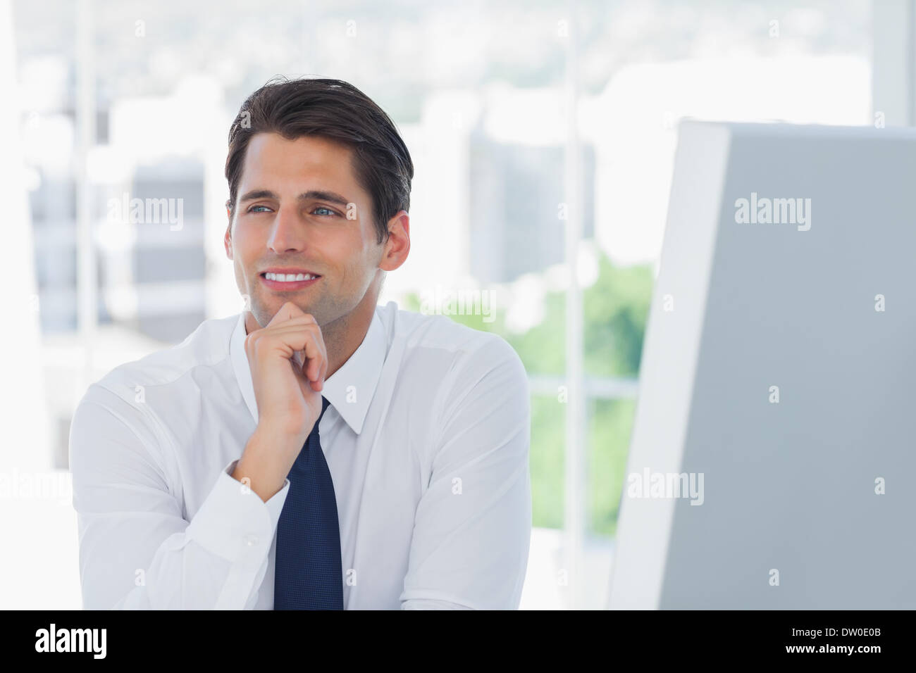 Thoughtful businessman posing looking away Stock Photo - Alamy