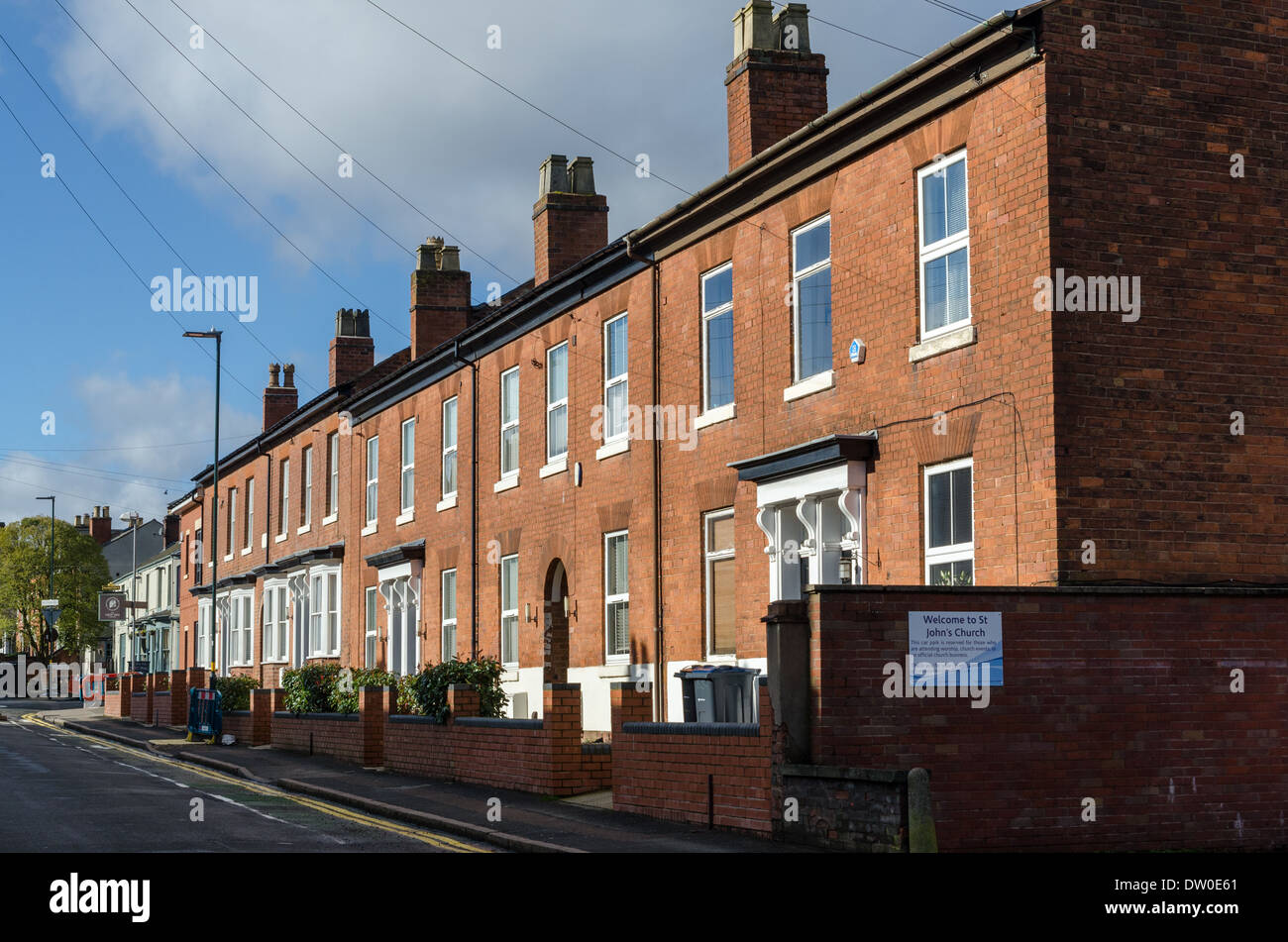 Row of neat red brick victorian terraced houses in Harborne, Birmingham Stock Photo