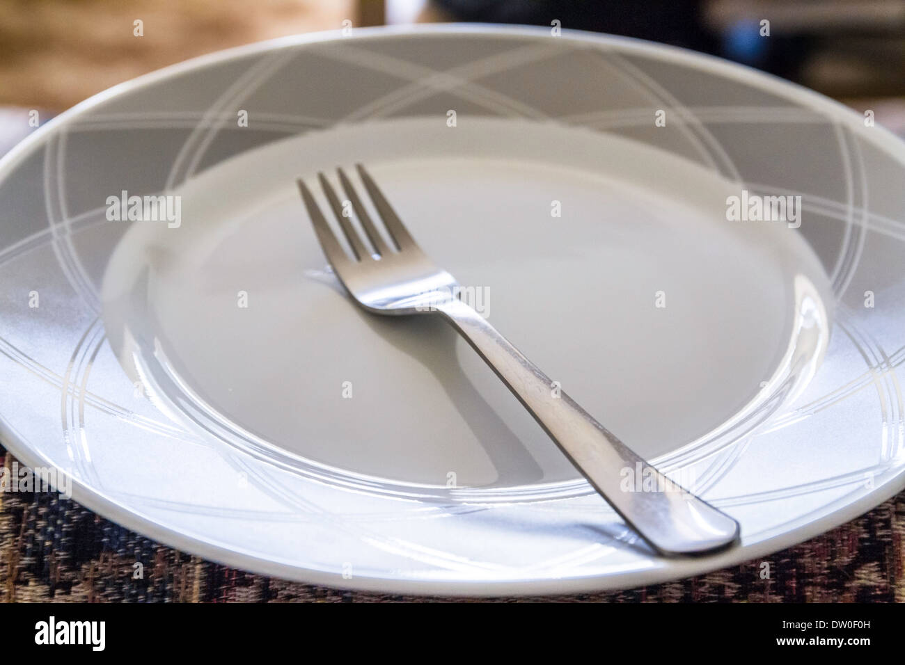 A white Corelle plate with gray trim made by Corning Glass Stock Photo