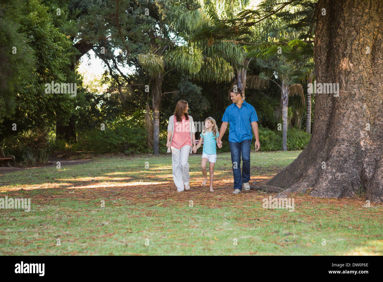 Woman walking in park speaking hi-res stock photography and images - Alamy