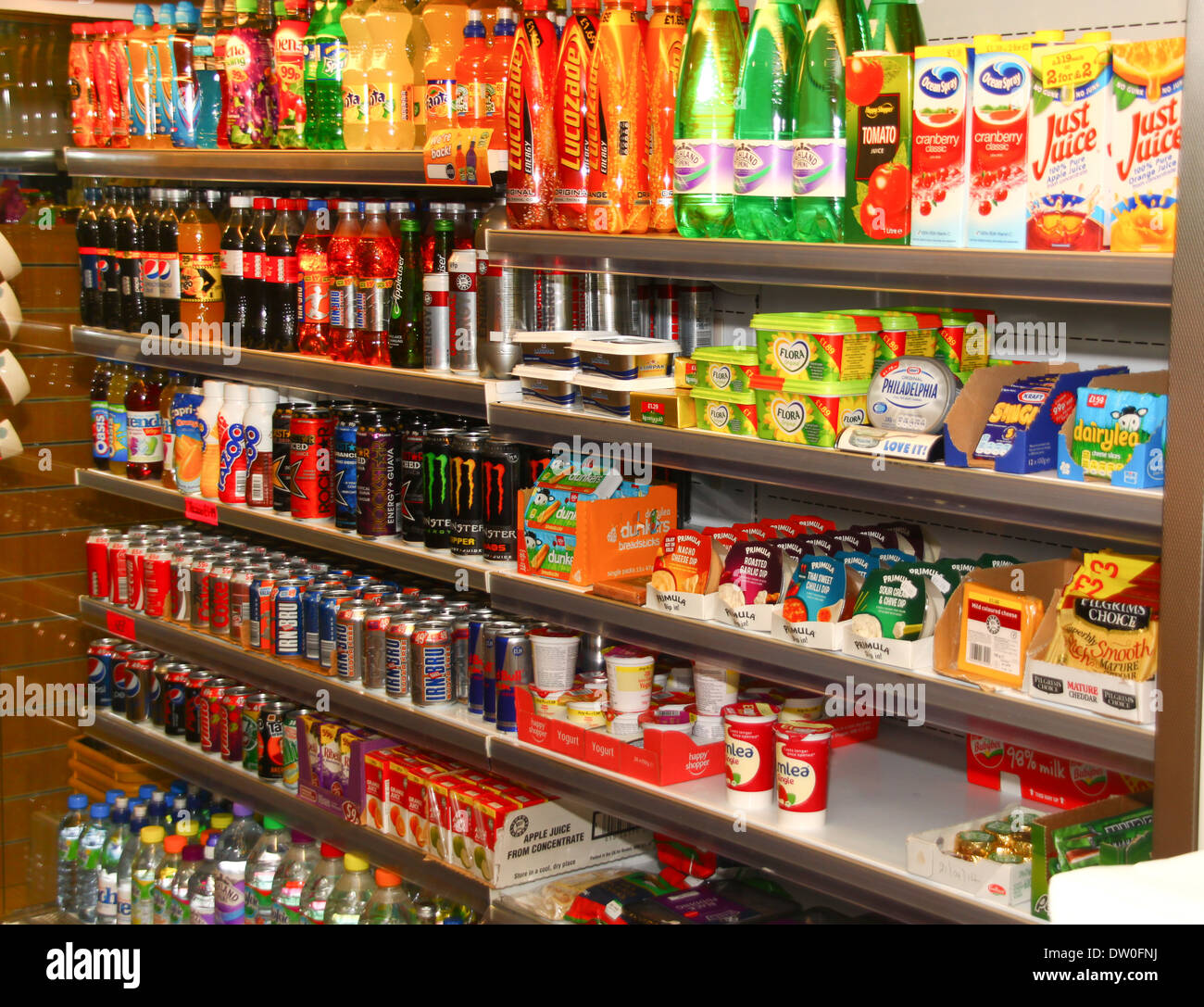 Groceries and drinks on shelves in small convenience store Stock Photo