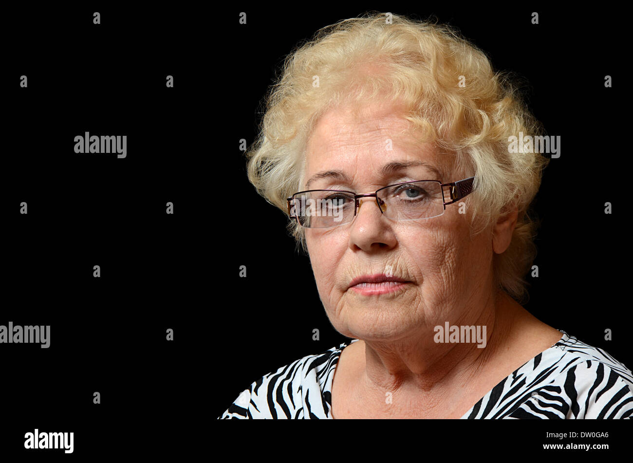 The elderly woman on black background Stock Photo