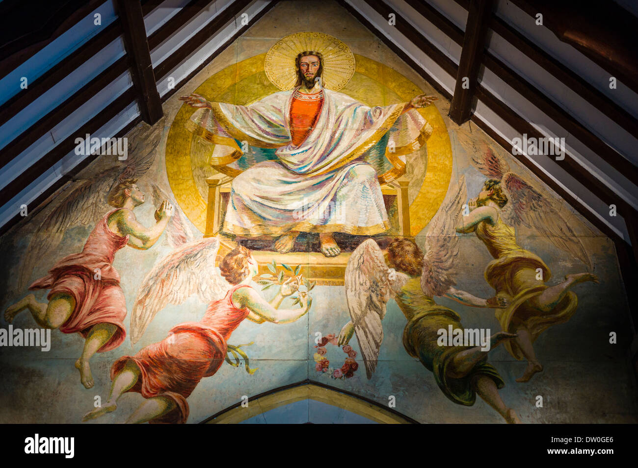 Religious wall painting inside church of St Michael & All Angles in Berwick Village UK Stock Photo