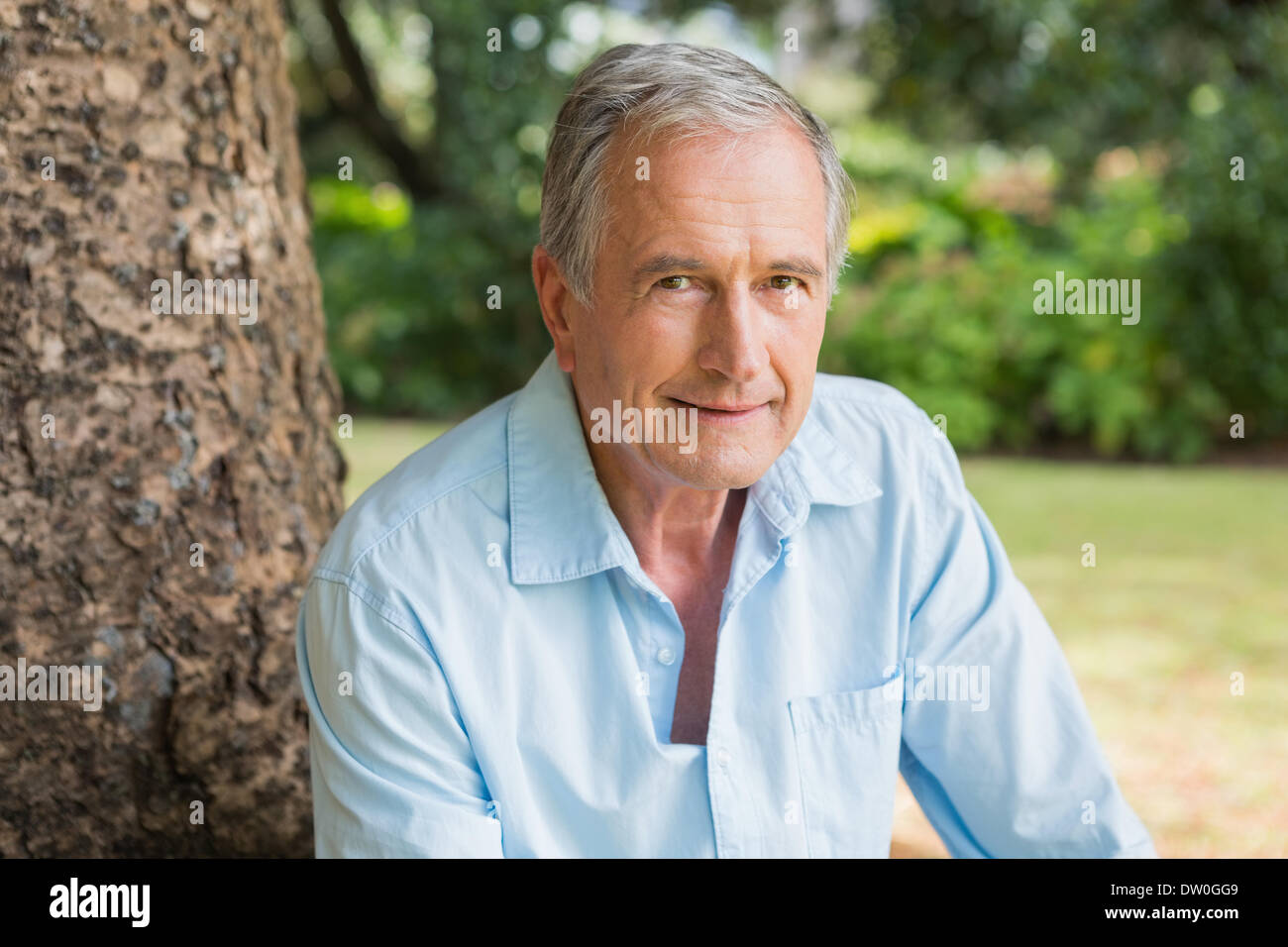 Smiling retired man sitting hi-res stock photography and images - Alamy
