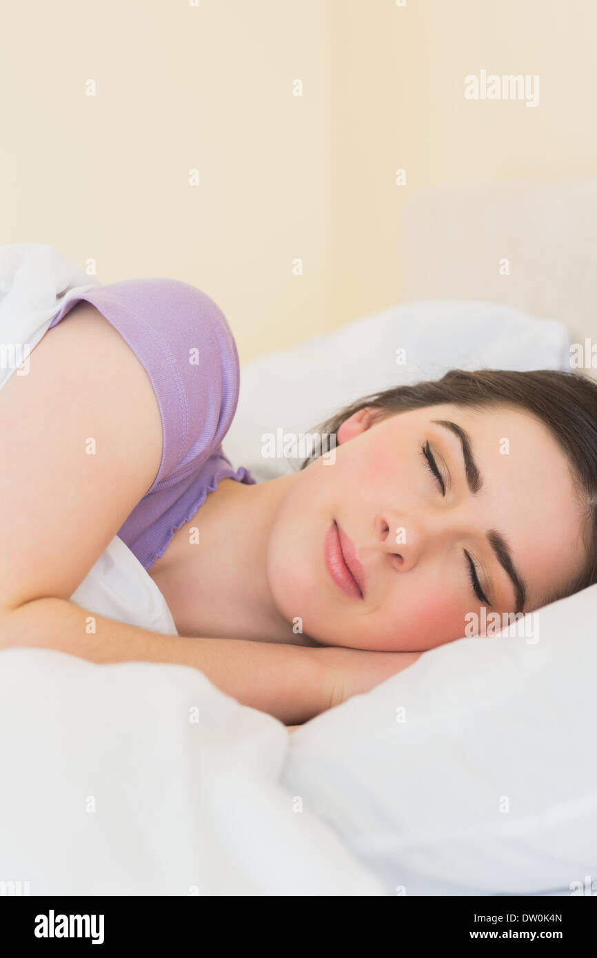 Happy girl sleeping in her bed Stock Photo Alamy