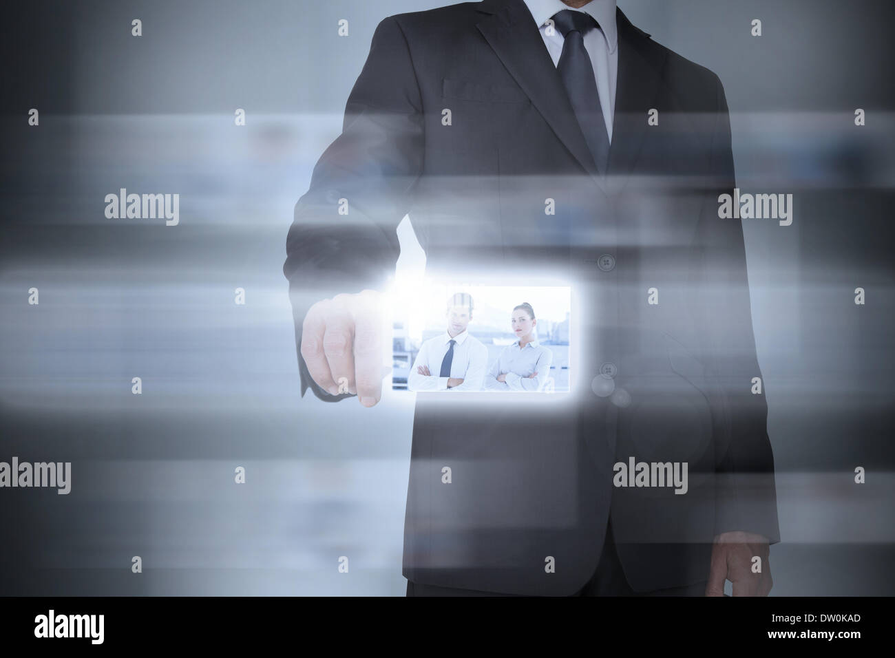 Stylish businessman using futuristic interface Stock Photo