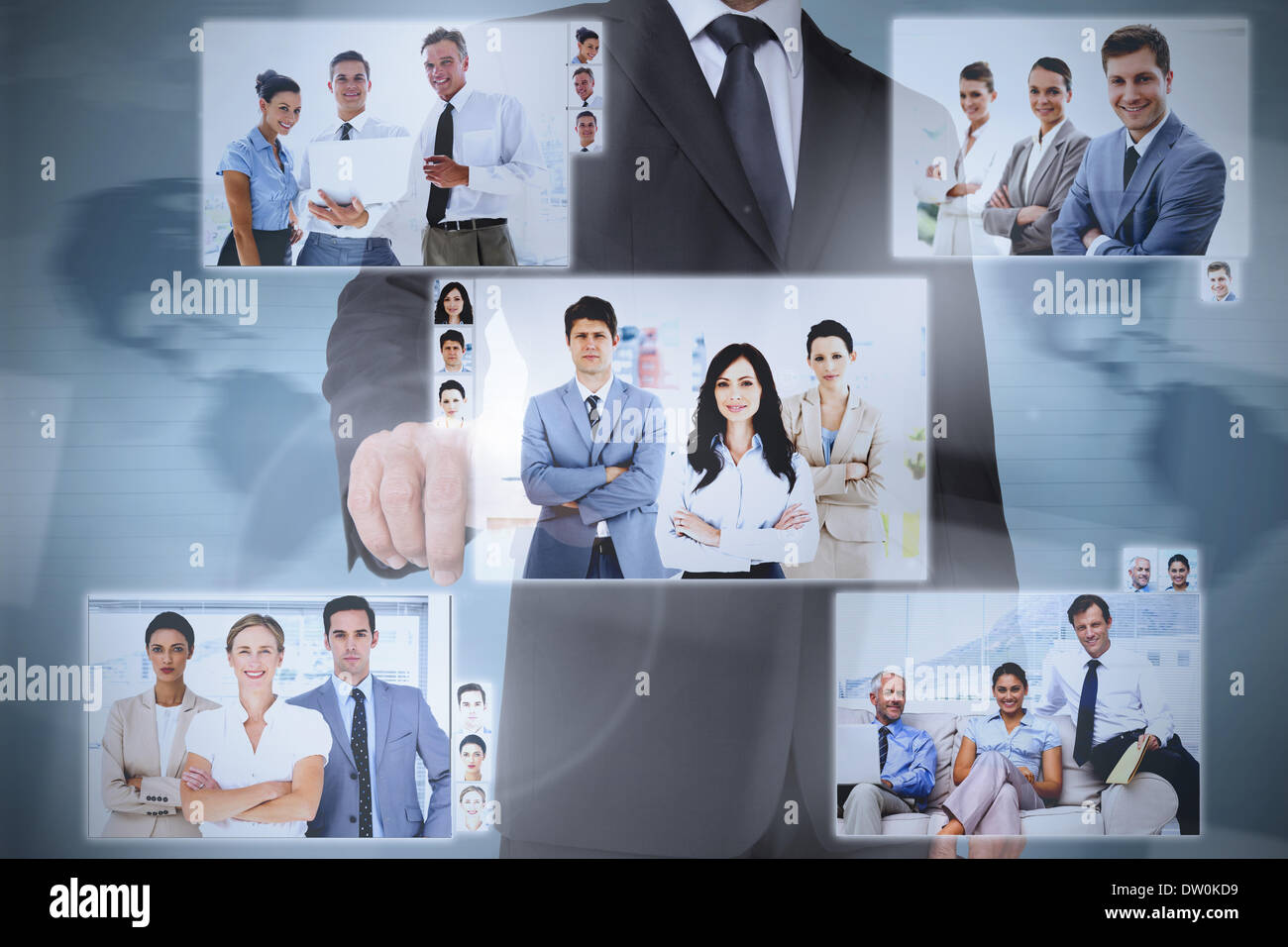 Businessman presenting pictures of coworkers Stock Photo