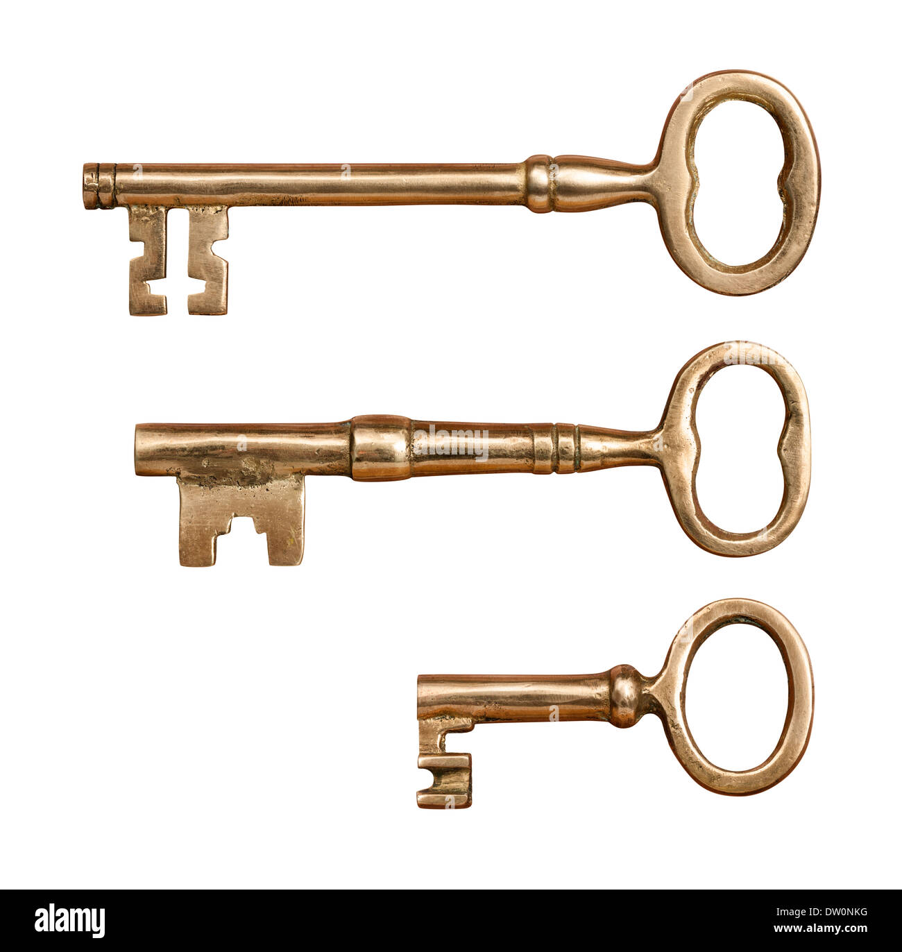 Three Antique Brass Keys isolated on white. Stock Photo