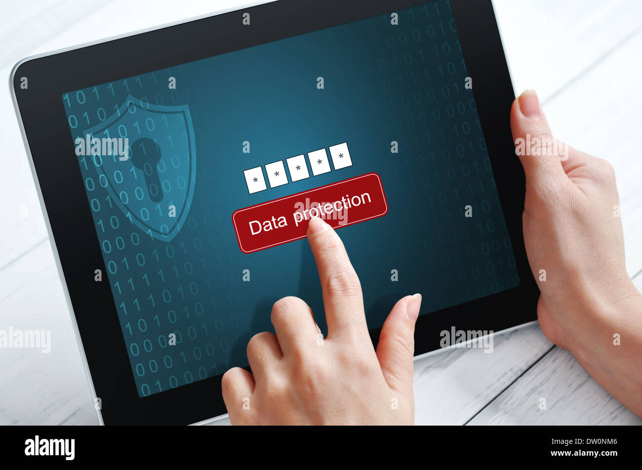Female hands using tablet pc protected with password Stock Photo