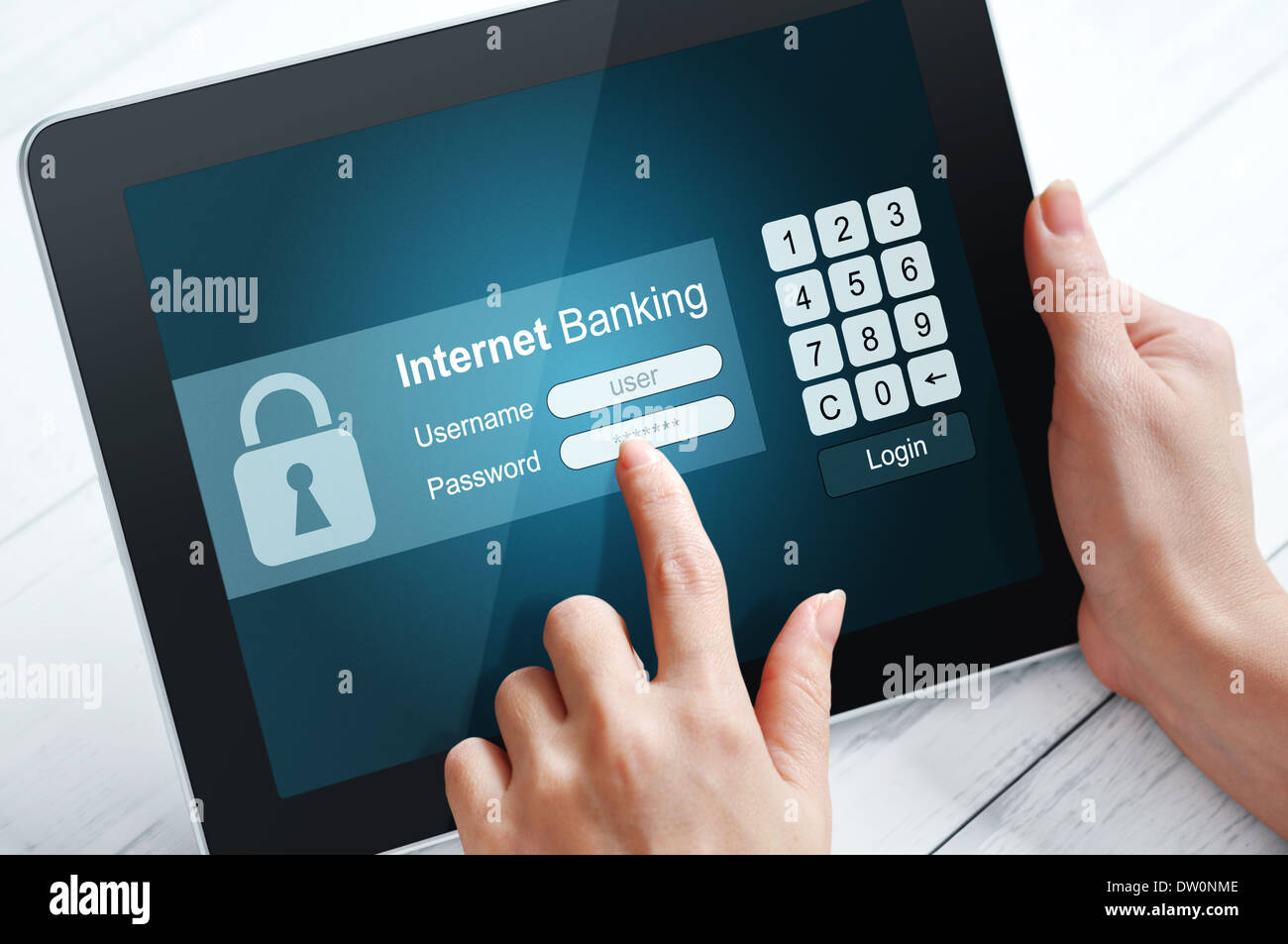 Female hands using tablet pc for internet banking Stock Photo